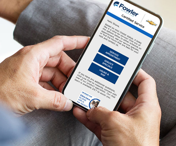 Person holding a phone with a dealer web site open